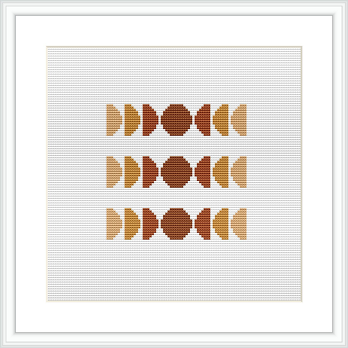 The image displays a framed cross stitch pattern featuring three rows of abstract geometric shapes, symmetrically arranged. The color palette used is subdued with shades of brown, tan, and cream. The design is centered within the frame on a white background.